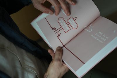 The opening chapter spread, mid-flip, illustrated with a line of falling dominoes